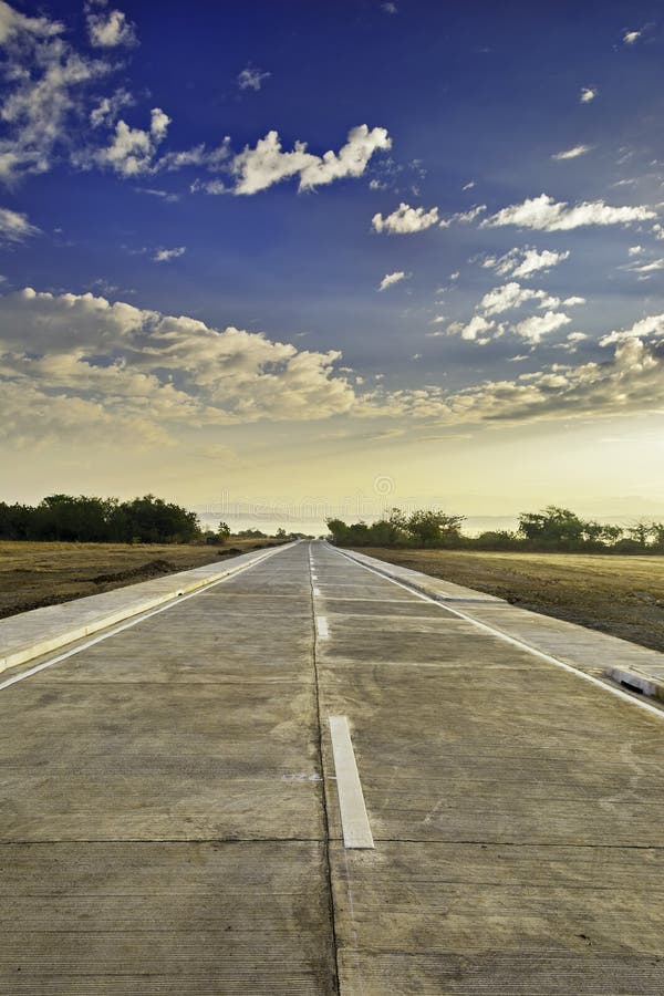 Newly built concrete road leading to a resort, Philippines. Newly built concrete road leading to a resort, Philippines