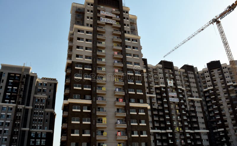 Cairo, Egypt, June 26 2022: new residential developmental housing apartments in downtown Cairo at the river Nile bank, real estate infrastructure development project, selective focus. Cairo, Egypt, June 26 2022: new residential developmental housing apartments in downtown Cairo at the river Nile bank, real estate infrastructure development project, selective focus