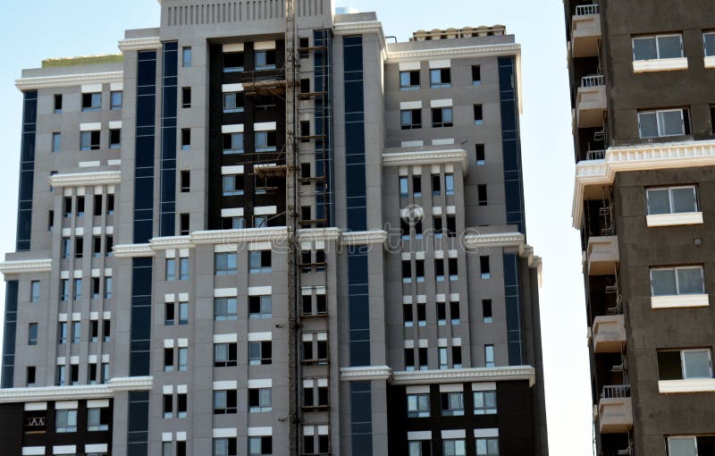 Cairo, Egypt, June 26 2022: new residential developmental housing apartments in downtown Cairo at the river Nile bank, real estate infrastructure development project, selective focus. Cairo, Egypt, June 26 2022: new residential developmental housing apartments in downtown Cairo at the river Nile bank, real estate infrastructure development project, selective focus