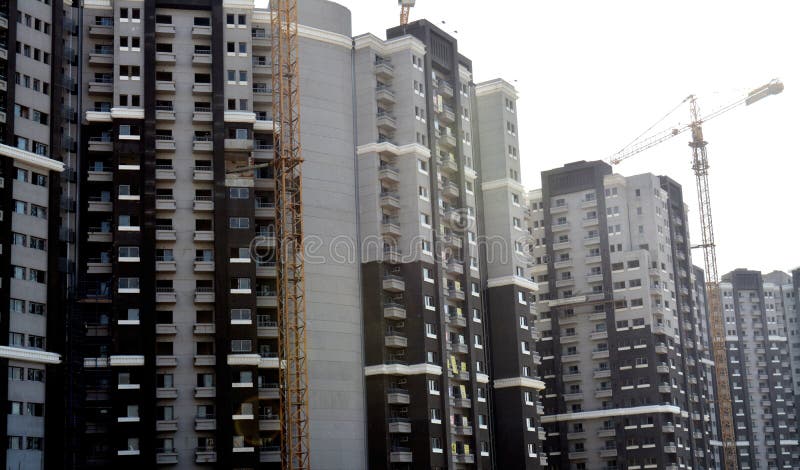 Cairo, Egypt, June 26 2022: new residential developmental housing apartments in downtown Cairo at the river Nile bank, real estate infrastructure development project, selective focus. Cairo, Egypt, June 26 2022: new residential developmental housing apartments in downtown Cairo at the river Nile bank, real estate infrastructure development project, selective focus