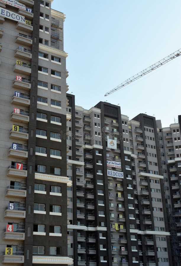 Cairo, Egypt, June 26 2022: new residential developmental housing apartments in downtown Cairo at the river Nile bank, real estate infrastructure development project, selective focus. Cairo, Egypt, June 26 2022: new residential developmental housing apartments in downtown Cairo at the river Nile bank, real estate infrastructure development project, selective focus