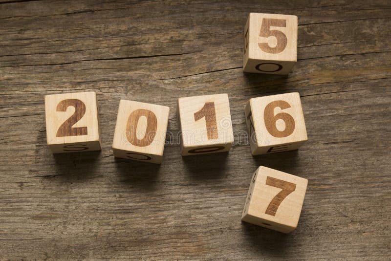 2016 New Year wooden cubes on a wooden background. 2016 New Year wooden cubes on a wooden background
