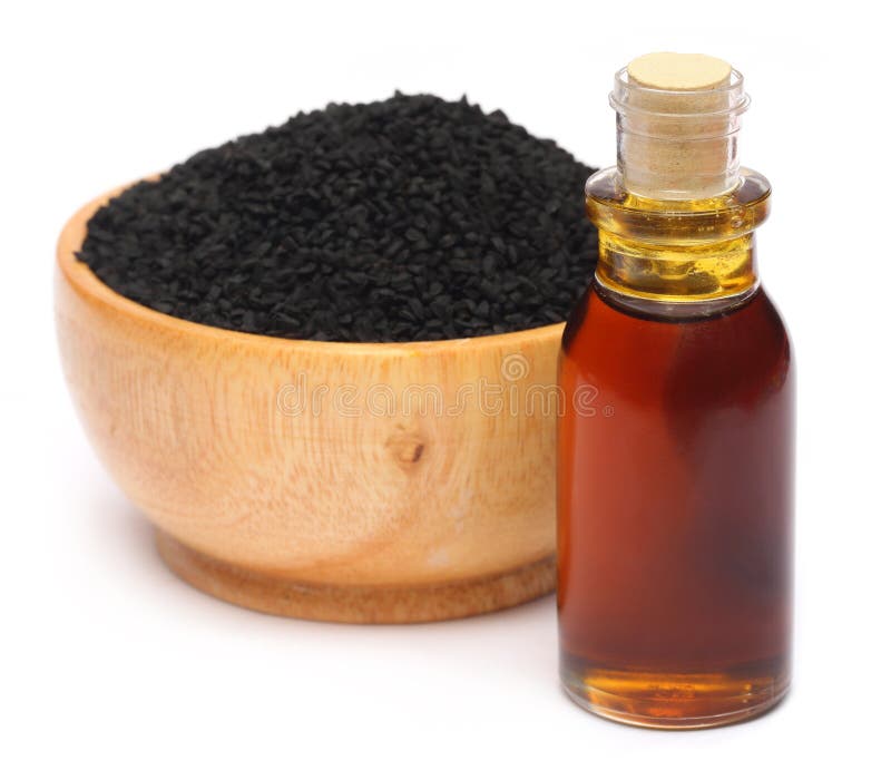 Nigella Sativa oder Schwarzkümmel mit ätherischem Öl lizenzfreies stockfoto