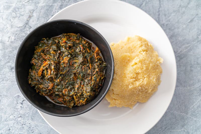 Nigerian Spicy Hot Vegetable Soup Served with Eba or Garri Stock Photo