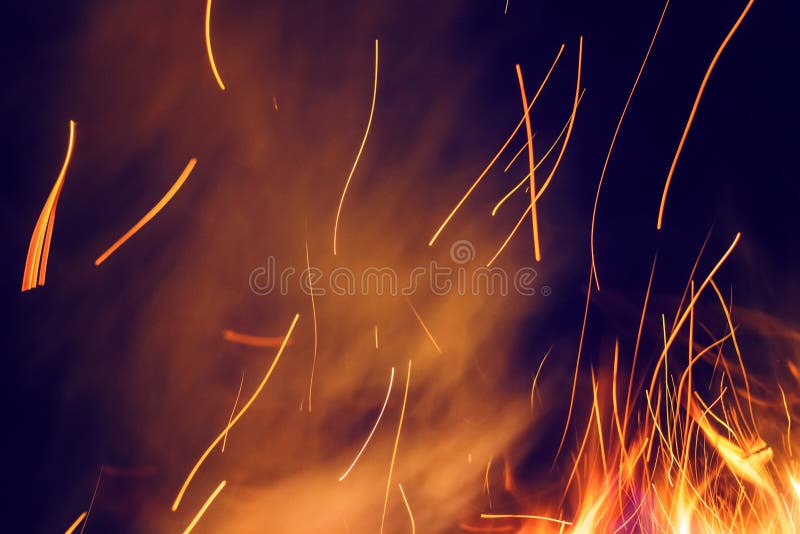 Night bonfire with sparks. Fire background with copyspace