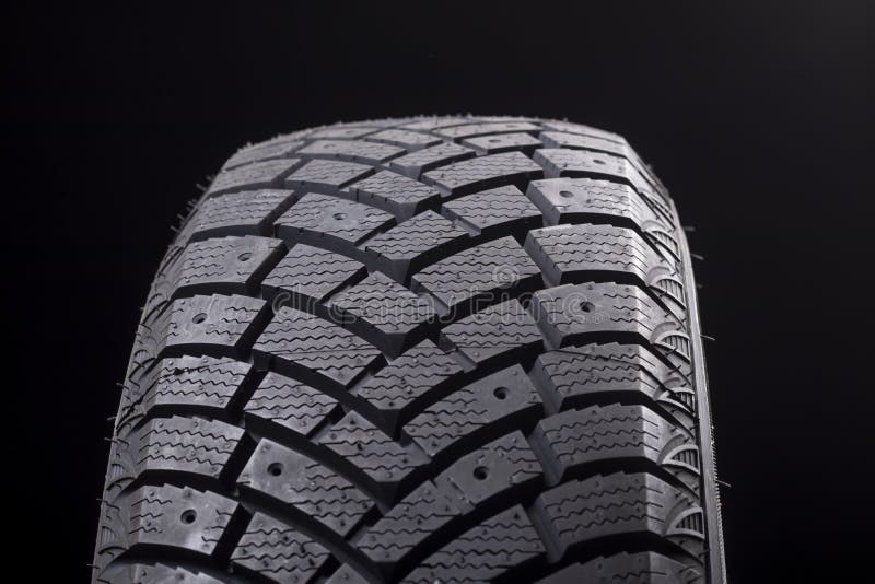 Night. the Car Tire is Black. Lighting with a Flashlight Stock Photo