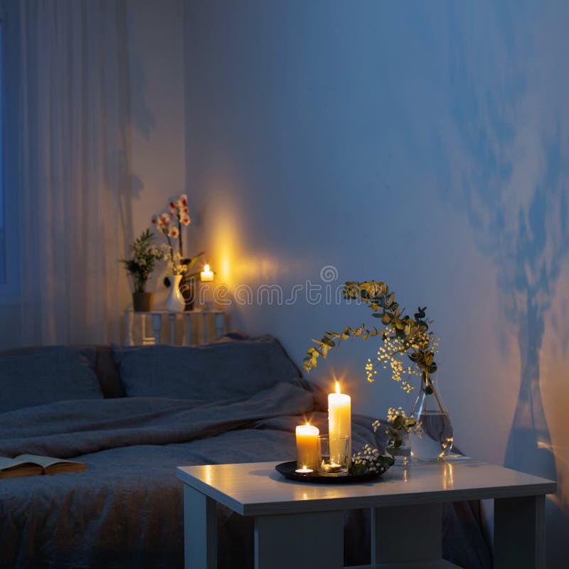 night-interior-bedroom-flowers-burning-candles-180845391.jpg