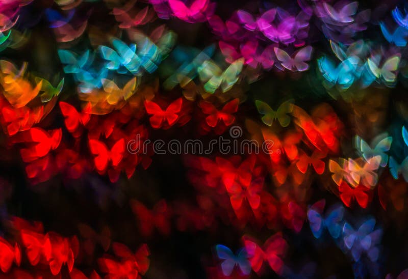 Night lights bokeh butterfly shape, defocused bokeh lights, blur stock photo