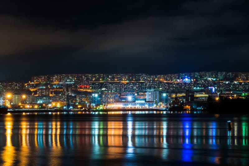 Night Murmansk, City Lights Reflected in the Bay and the Ships Standing ...
