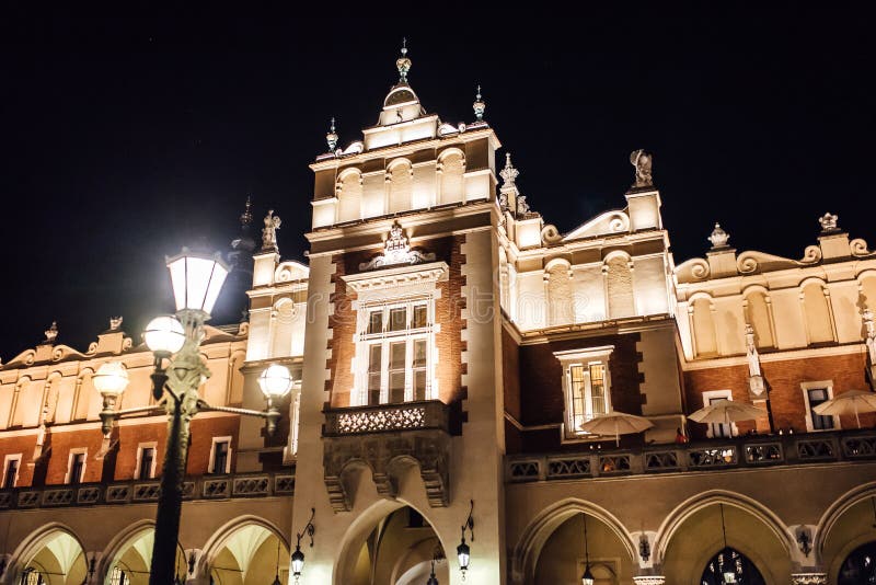 Night old commercial area of Krakow in the lights of street lamp