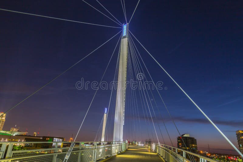 Night scene of Omaha Kerrey suspension bridge tower with suspension cables with beautiful sky colors just after sunset