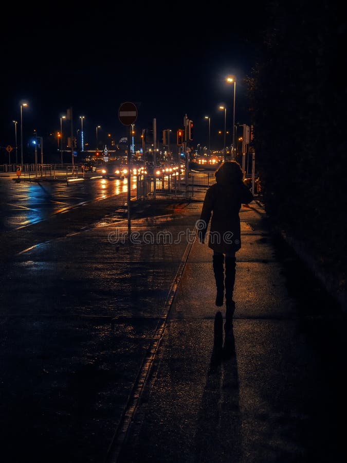 Teenager Girl Walking To Town in a Dark on Night Out. Stock Image ...