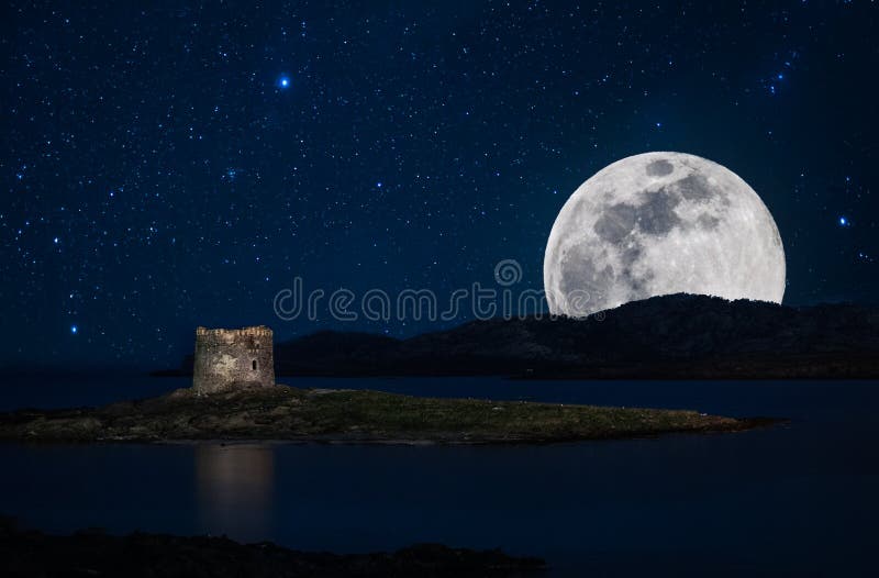 Night seascape in Sardinia with tower on the coast in La Pelosa Beach, in Stintino, with starry sky and super moon royalty free stock images Night seascape in Sardinia with tower on the coast in La Pelosa Beach, in Stintino, with starry sky and super moon royalty free stock images
