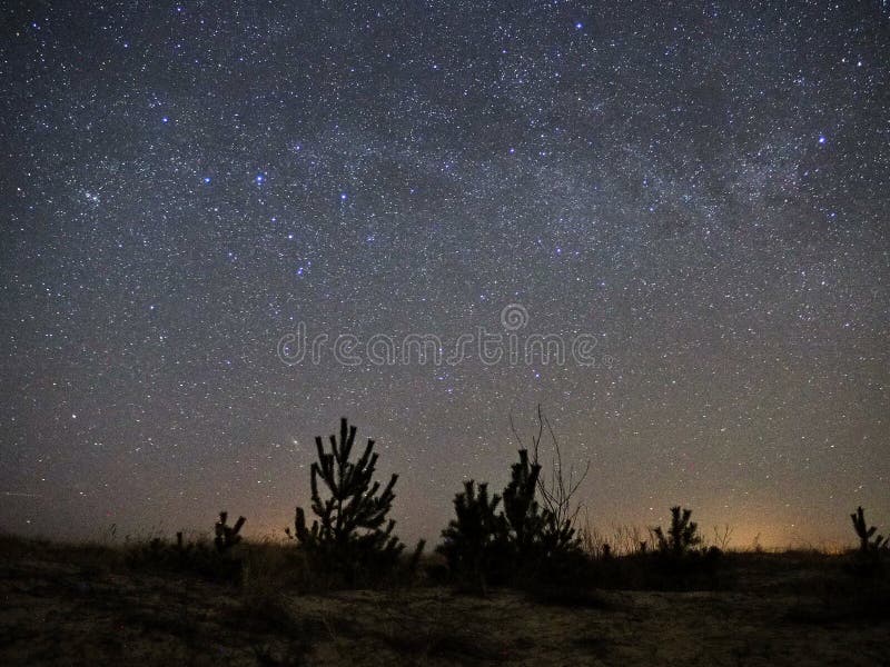 Night sky and milky way stars, Cassiopeia and andromeda constellation over sea stock photography Night sky and milky way stars, Cassiopeia and andromeda constellation over sea stock photography