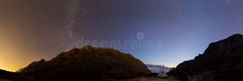 Night sky over white tent in mountains of Mallorca stock photography