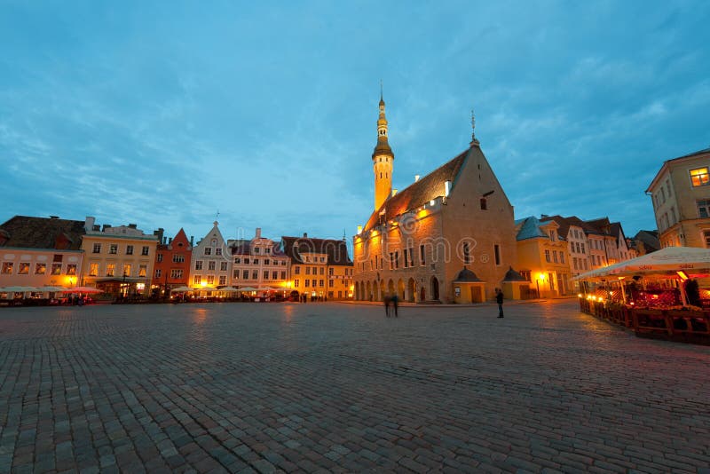 Tallinn, Estonia - June 5, 2012: A night Town Hall square in the Old Town of Tallinn, which is included in the UNESCO World Heritage. GPS information is in the file. Tallinn, Estonia - June 5, 2012: A night Town Hall square in the Old Town of Tallinn, which is included in the UNESCO World Heritage. GPS information is in the file