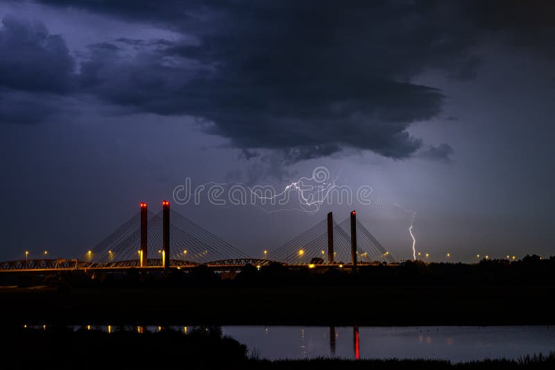 Image of Lightning in the Night Hitting a House on the Ground Stock