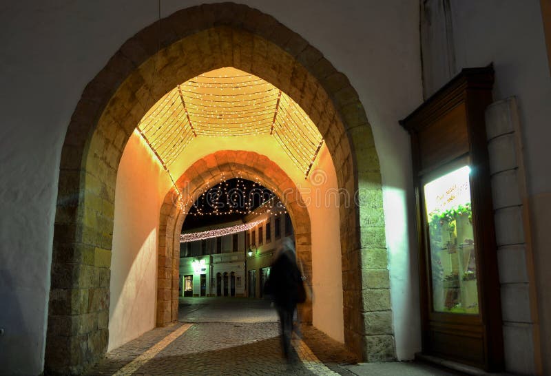 Night town - illuminated gate in Trencin city centre