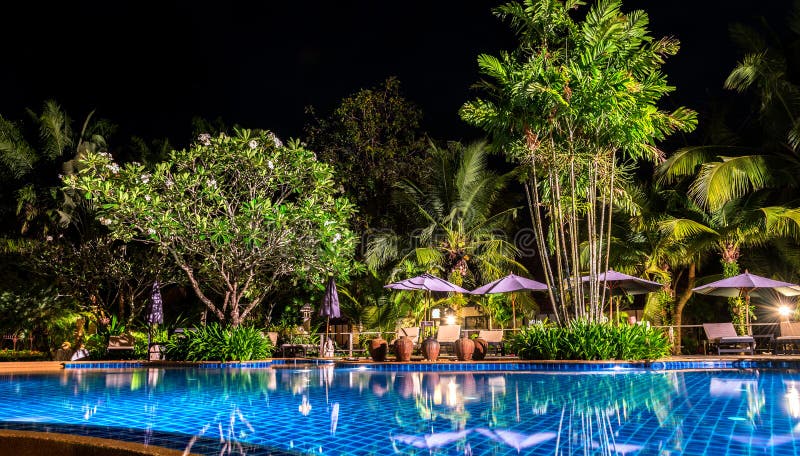 Night view of beautiful swimming pool in tropical resort , Koh Chang Thailand