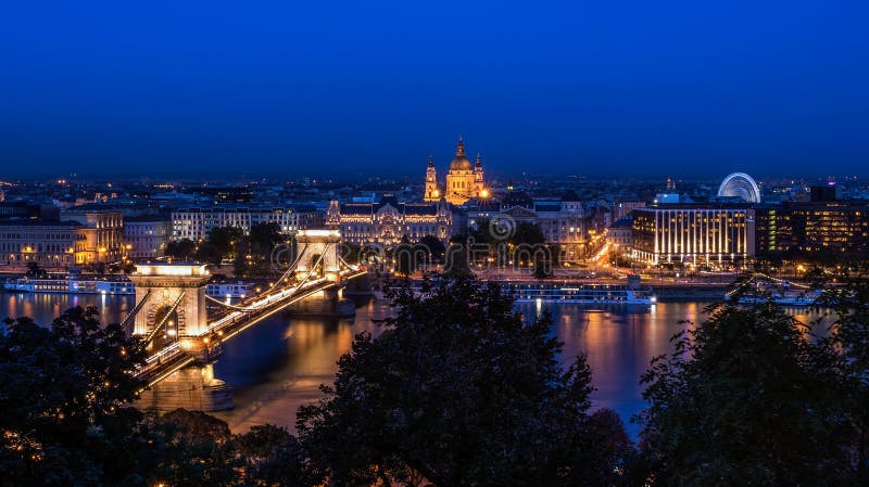 The night view of the Chain bridge, Saint Istvan's basilica and the Danube in Budapest from the Buda castle area