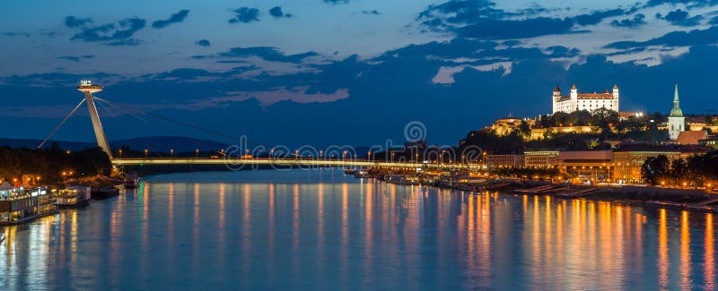Night view on new bridge in Bratislava with castle on right side royalty free stock image Night view on new bridge in Bratislava with castle on right side royalty free stock image