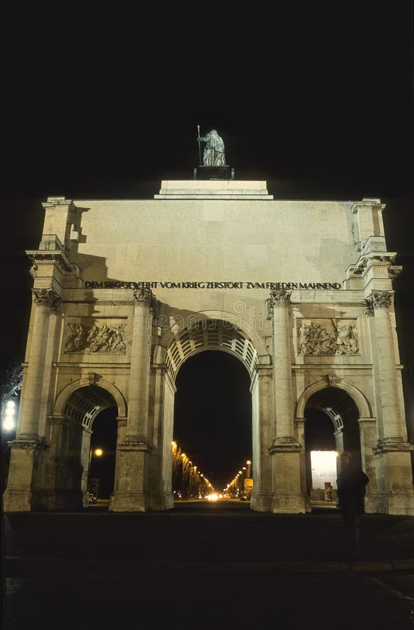 Night view of Siegestor triumphal arch in Schwabing Munich Germany illuminated historic monument and classical architecture royalty free stock photo