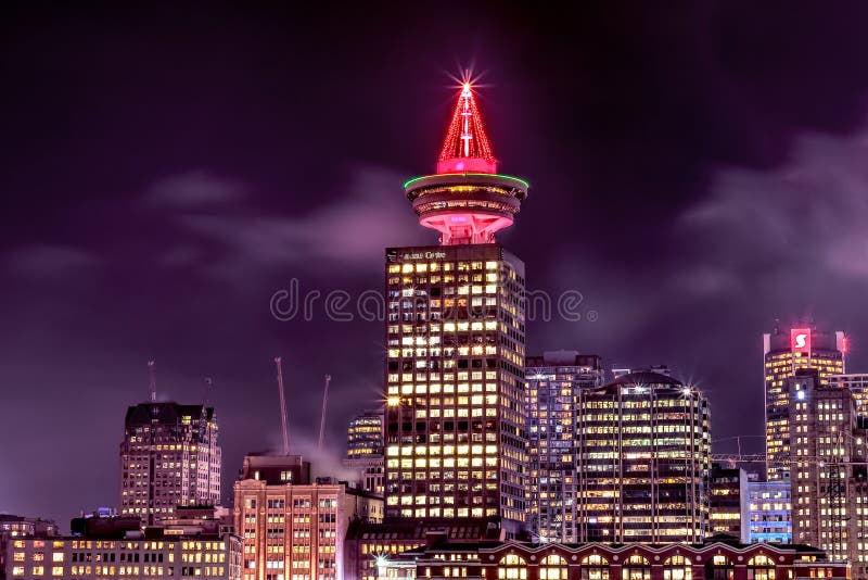 Night view of Vancouver lookout Harbour Centre with Decorated Christmas Tree on top of the tower stock image Night view of Vancouver lookout Harbour Centre with Decorated Christmas Tree on top of the tower stock image