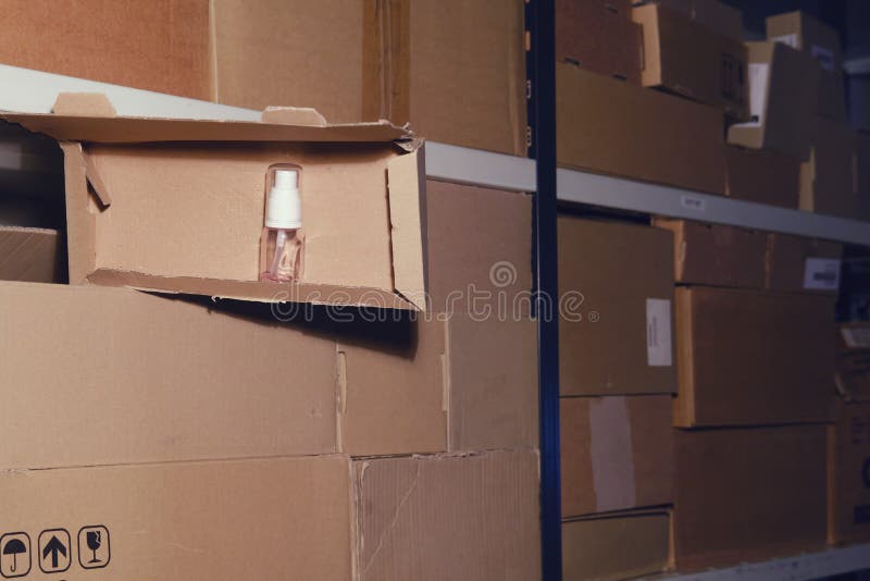 Night Warehouse and Open Box with Sanitizer, Closeup Stock Image