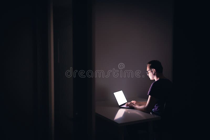 Young Hacker Programmer with Laptop Hacks Programs and Site. Stock ...