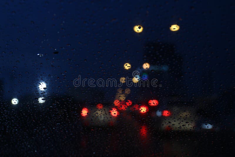 Nightlife background bokeh and raindrop on glass blurred bokeh lighting colorful condensation stock photography