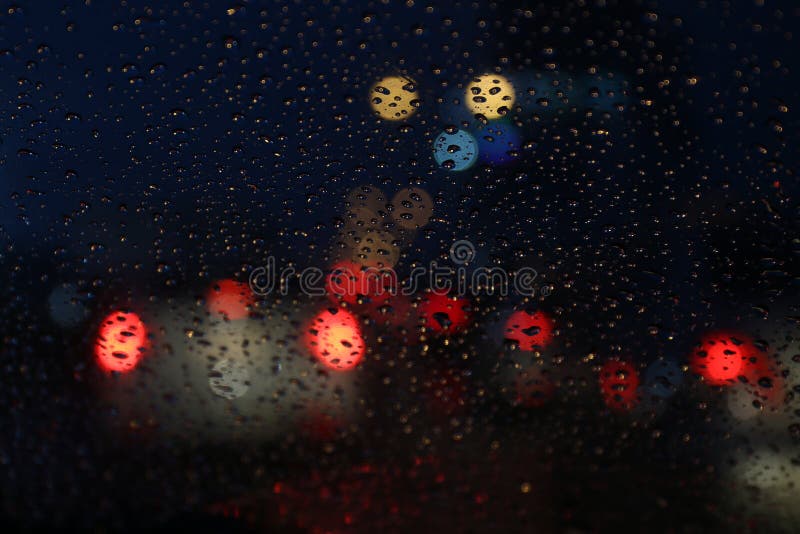 Nightlife background bokeh and raindrop on glass blurred bokeh lighting colorful condensation royalty free stock images