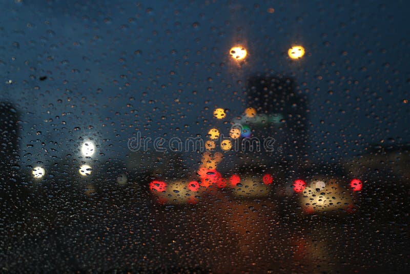 Nightlife background bokeh and raindrop on glass blurred bokeh lighting colorful condensation royalty free stock image