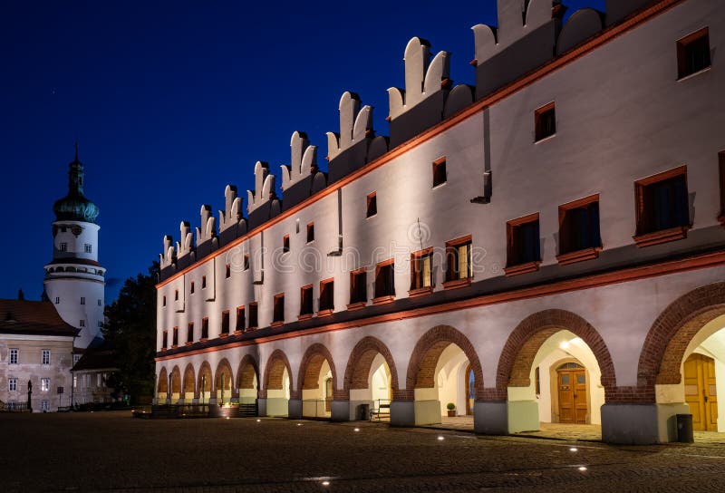 Nightscape of illuminated castle tower and renaissance building on Husovo square, Nove Mesto nad Metuji, Czech Republic stock images Nightscape of illuminated castle tower and renaissance building on Husovo square, Nove Mesto nad Metuji, Czech Republic stock images