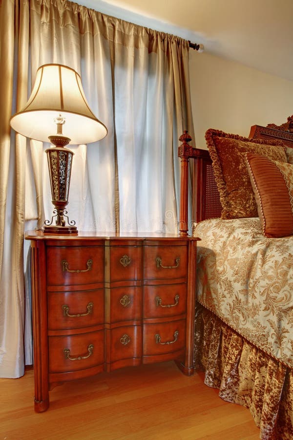 Nightstand With Lamp Near The Bed Stock Image Image of antique