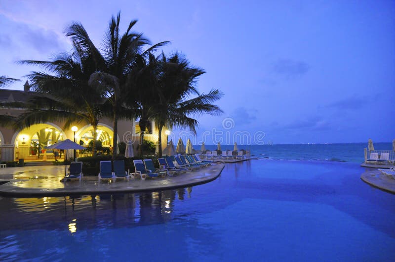 Yucatan Mexico Cancun during nightfall at the pool. Yucatan Mexico Cancun during nightfall at the pool