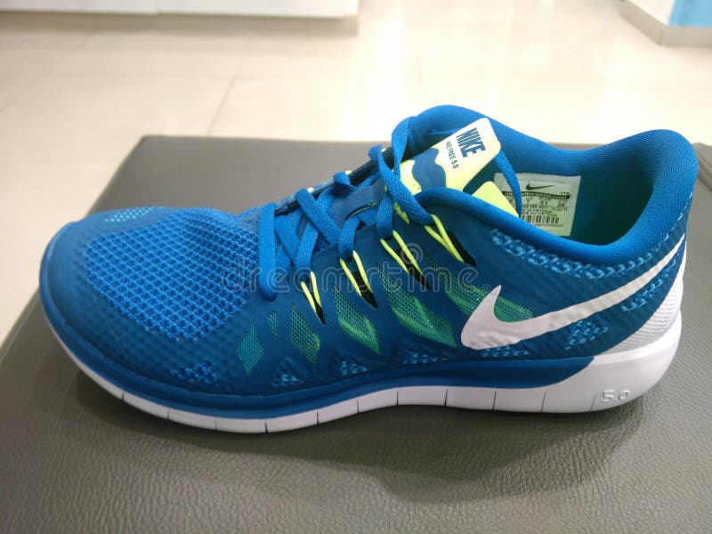 neon blue nike shoes