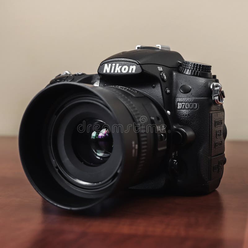 Nikon dslr camera on wooden table, close up stock image Nikon dslr camera on wooden table, close up stock image