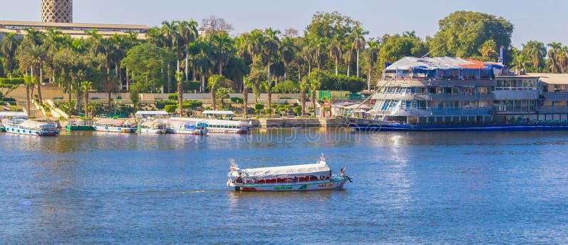 Nile river in Cairo Egypt & ship and green grass