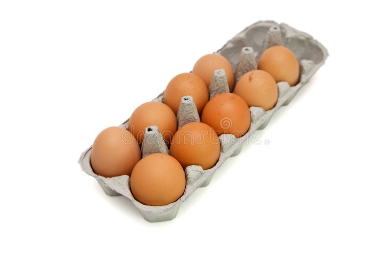 Nine brown eggs in a box isolated