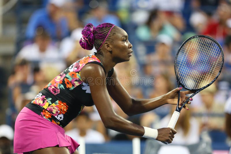 Nine times Grand Slam champion Venus Williams during first round doubles match with teammate Serena Williams at US Open 2013. NEW YORK - AUGUST 29 Nine times stock photography
