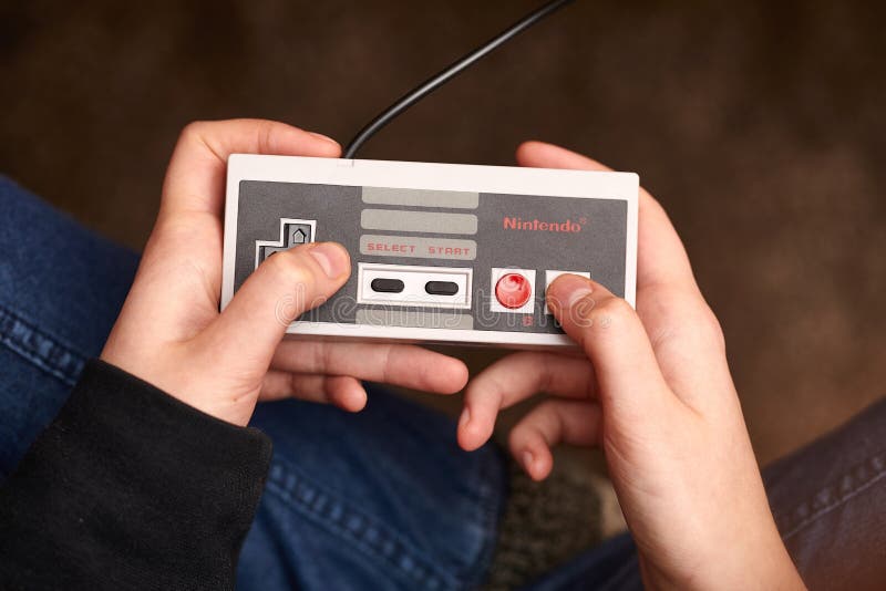 The Nintendo Entertainment System (NES), an 8-bit third-generation home  video game console produced by Nintendo. NES Control Deck home video game  console with controllers. Stock Photo