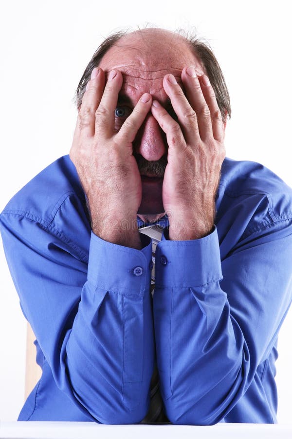 Man hiding his face in his hands. Man hiding his face in his hands