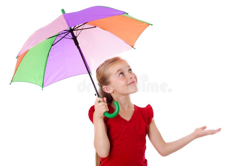 Little girl standing under colorful umbrella and looking up, isolated on white. Little girl standing under colorful umbrella and looking up, isolated on white