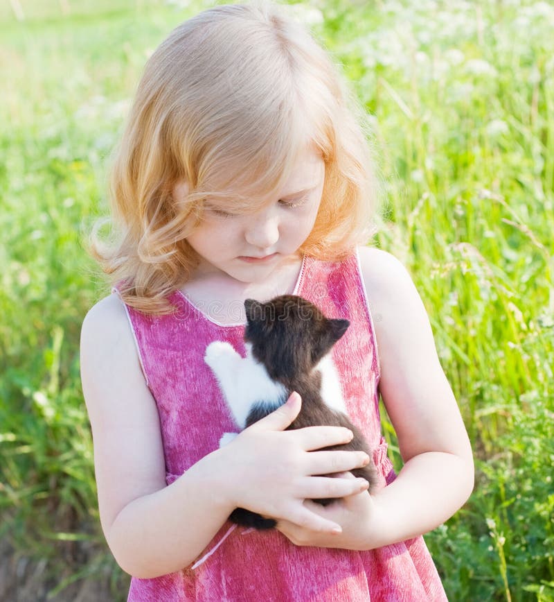 Little girl with cat outdoor. Little girl with cat outdoor