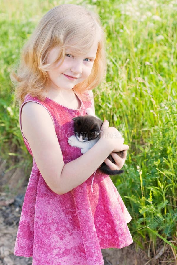 Little girl with cat outdoor. Little girl with cat outdoor