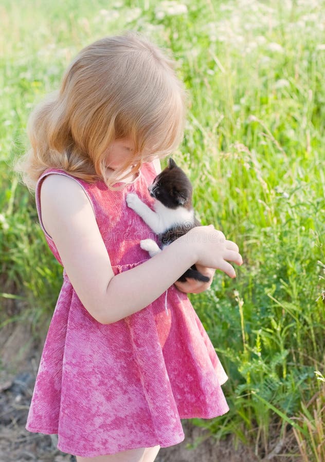 Little girl with cat outdoor. Little girl with cat outdoor