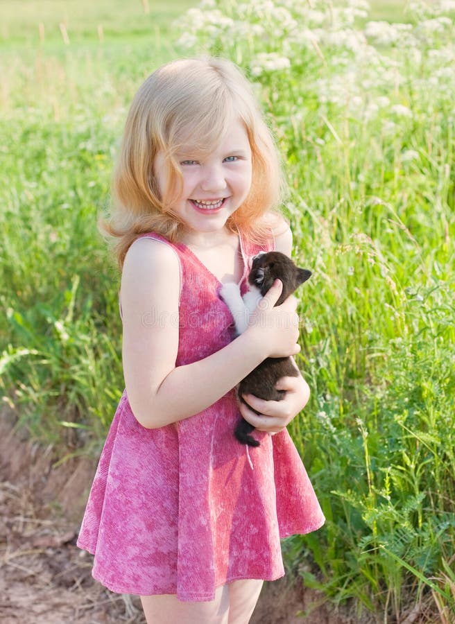 Little girl with cat outdoor. Little girl with cat outdoor