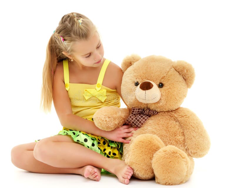 Niña con el oso de peluche foto de archivo