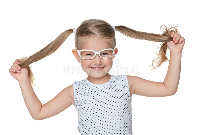 Niña con las coletas fotografía de archivo libre de regalías Niña con las coletas fotografía de archivo libre de regalías
