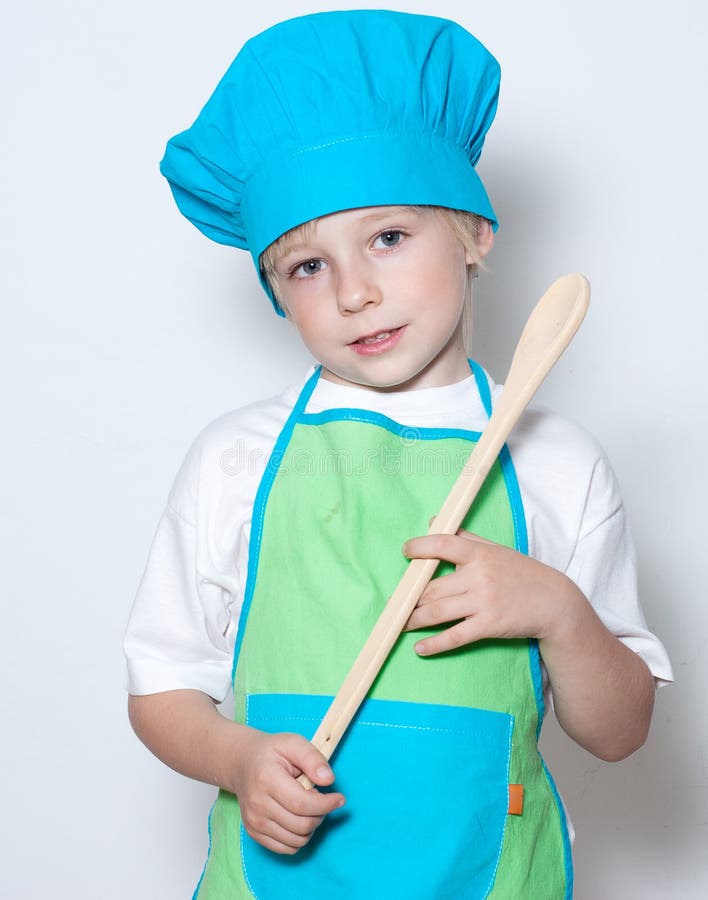 Niño como cocinero del cocinero imágenes de archivo libres de regalías Niño como cocinero del cocinero imágenes de archivo libres de regalías
